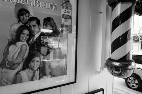 A vintage framed advertisement on the wall of the shop.