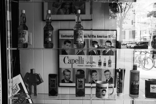 A vintage tonic display in the front window of the shop.
